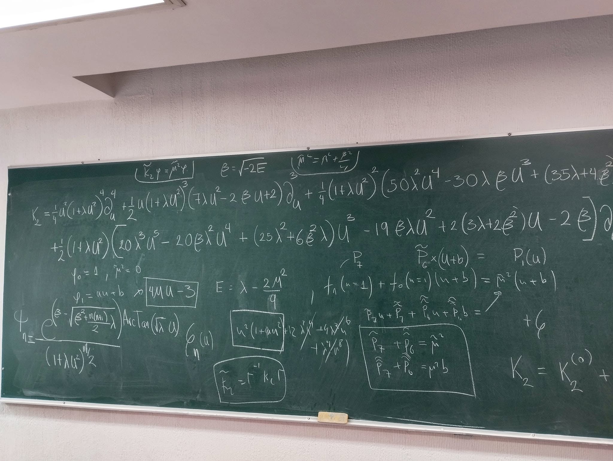 Blackboard with calculations in mathematical physics